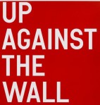 against the wall